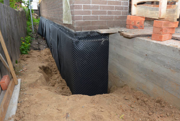 SJ Waterproofing Pros technician performing targeted Vapor Barrier Installation assessment in Downers Grove, IL